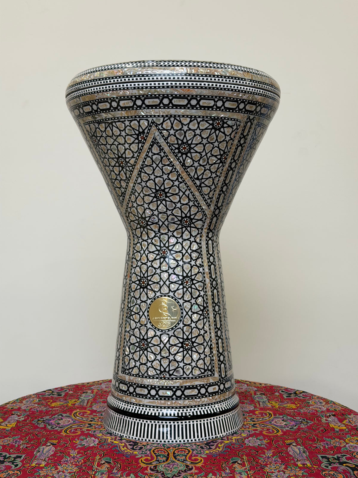 Front view of The Anchor 20-inch Gawharet El Fan Dohola darbuka on a table